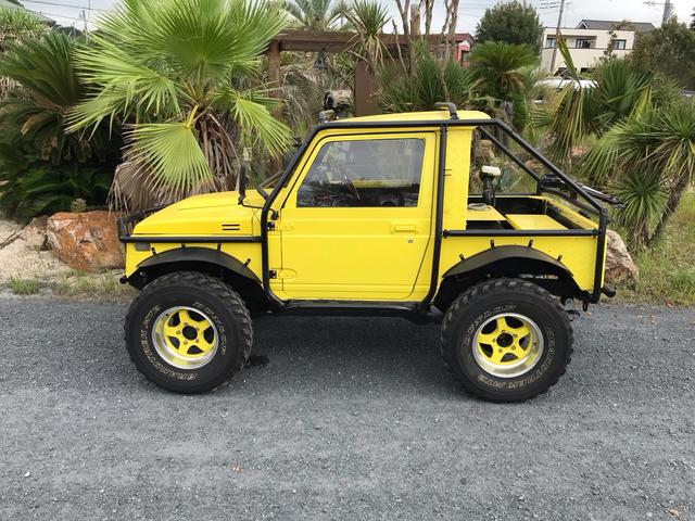 ジムニー サマーウインド　リミテッド　ＡＣ　ＰＳ　５ＭＴ　社外リーフリフトアップ　改造公認車　バンカット車　前後エアロッカー　ダウンギア　油圧電動Ｗパワステ　強化シャフト　ワンオフロールバー　２５５ＭＴタイヤ　ウィンチ　社外前後バンパー（9枚目）