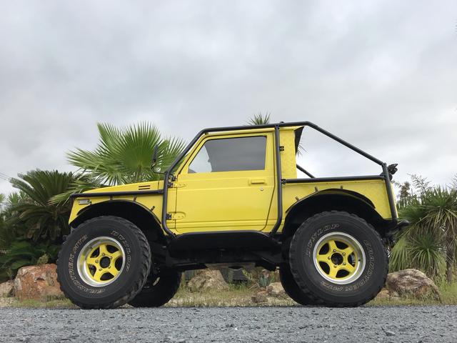 ジムニー サマーウインド　リミテッド　ＡＣ　ＰＳ　５ＭＴ　社外リーフリフトアップ　改造公認車　バンカット車　前後エアロッカー　ダウンギア　油圧電動Ｗパワステ　強化シャフト　ワンオフロールバー　２５５ＭＴタイヤ　ウィンチ　社外前後バンパー（10枚目）