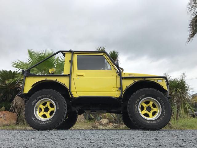 ジムニー サマーウインド　リミテッド　ＡＣ　ＰＳ　５ＭＴ　社外リーフリフトアップ　改造公認車　バンカット車　前後エアロッカー　ダウンギア　油圧電動Ｗパワステ　強化シャフト　ワンオフロールバー　２５５ＭＴタイヤ　ウィンチ　社外前後バンパー（22枚目）