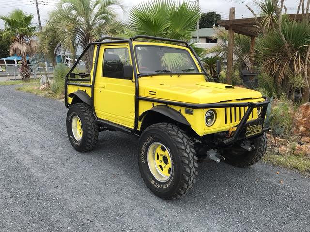 ジムニー サマーウインド　リミテッド　ＡＣ　ＰＳ　５ＭＴ　社外リーフリフトアップ　改造公認車　バンカット車　前後エアロッカー　ダウンギア　油圧電動Ｗパワステ　強化シャフト　ワンオフロールバー　２５５ＭＴタイヤ　ウィンチ　社外前後バンパー（23枚目）