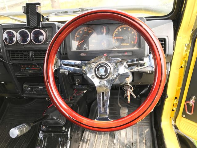 ジムニー サマーウインド　リミテッド　ＡＣ　ＰＳ　５ＭＴ　社外リーフリフトアップ　改造公認車　バンカット車　前後エアロッカー　ダウンギア　油圧電動Ｗパワステ　強化シャフト　ワンオフロールバー　２５５ＭＴタイヤ　ウィンチ　社外前後バンパー（29枚目）