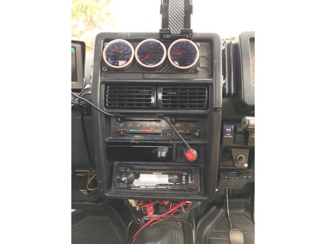 ジムニー サマーウインド　リミテッド　ＡＣ　ＰＳ　５ＭＴ　社外リーフリフトアップ　改造公認車　バンカット車　前後エアロッカー　ダウンギア　油圧電動Ｗパワステ　強化シャフト　ワンオフロールバー　２５５ＭＴタイヤ　ウィンチ　社外前後バンパー（32枚目）