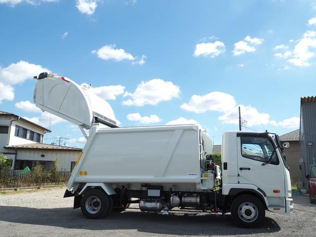 ファイター 　未使用　新明和　ＧＴ１０４－５７３４Ｐ　塵芥車／パッカー車　プレス式　ダンボール／ペーパー仕様　容積１０．２立米　連続スイッチ　汚水タンク　ターボ２２０馬力　積載１．２５ｔ　６速ＭＴ　バックモニター（9枚目）
