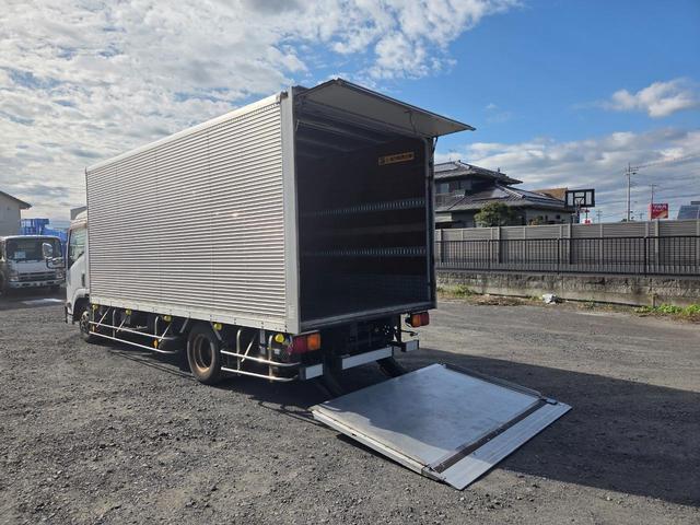 エルフトラック ディーラーにてエンジン載替済み ワイド超ロング アルミバン 日本フルハーフ コンビゲート(上蓋+跳ね上げパワーゲート) 昇降能力1000kg 庫内有線リモコン付 ラッシング2段 スムーサー(2ペダル)(10枚目)