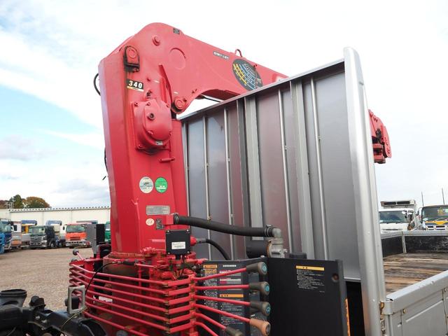 ヒノレンジャー 　標準幅　古河ユニック　ＵＲＵ３４４ＲＫＫ　４段クレーン　フックイン　２．９３ｔ吊　ラジコン付　上物同年　平ボディ　三方開　内フック（丸環）　軽々ゲート　ターボ２１０馬力　ベッド付　積載２．６ｔ　ＨＩＤ（59枚目）