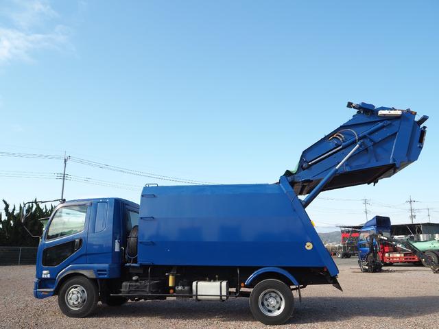 ファイター 　富士車輌製　パッカー車／塵芥車　ＰＬ４１０９　プレス式　容積１０立米　連続スイッチ　汚水タンク付　上物同年　リーフサス　ターボ２４０馬力　積載１．７ｔ　６速ＭＴ　ベッド付き　坂道発進補助装置（11枚目）