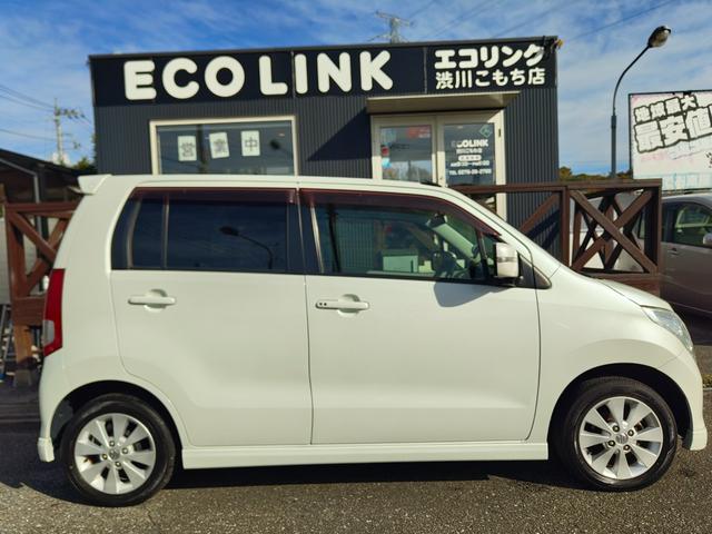 ワゴンＲ ＦＸリミテッドＩＩ　検９年４月　歴無　スマートキー・プッシュスタート・電格ミラー・オートエアコン・フルフラットシート・ヘッドライトレベライザー・車載工具・パンク修理キット・空気入れ・ポータブルカーナビ・１５５／６５／１４（9枚目）