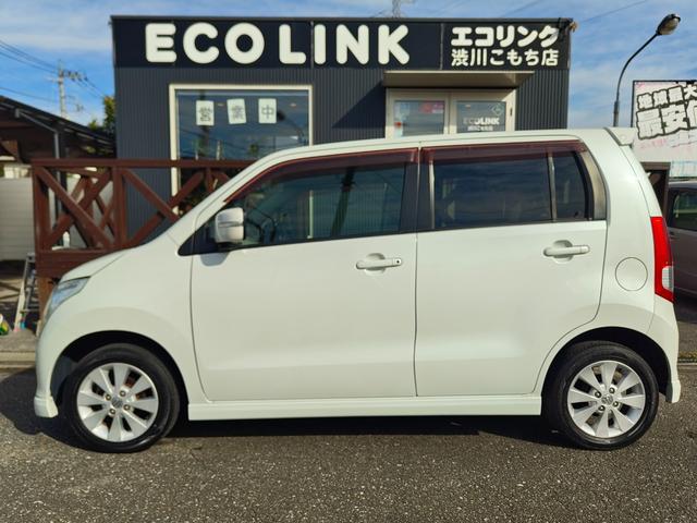 ワゴンＲ ＦＸリミテッドＩＩ　検９年４月　歴無　スマートキー・プッシュスタート・電格ミラー・オートエアコン・フルフラットシート・ヘッドライトレベライザー・車載工具・パンク修理キット・空気入れ・ポータブルカーナビ・１５５／６５／１４（10枚目）