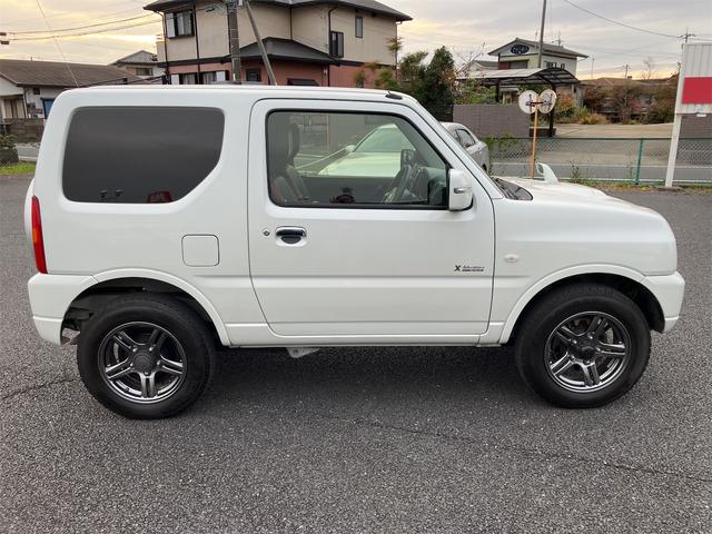 ジムニー クロスアドベンチャー エアコン パワーステアリング パワーウィンドウ Wエアバッグ ABS 社外ナビ ETC車載器 ドライブレコーダー 本革シート 純正アルミ キーレス(4枚目)