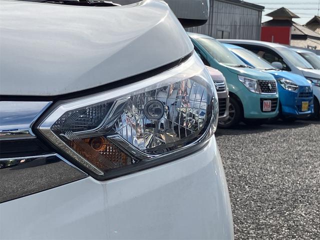 eKワゴン M Wエアバック ABS レーダーブレーキ フルセグTV アイドリングSTOP エアコン 純正ナビ パワーステアリング キーレスエントリー プライバシーガラス バックカメラ シートヒーター オートライト(30枚目)