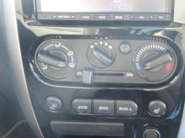 ジムニー ランドベンチャー　前席パワーウインドウ　助手席エアバック　運転席エアバッグ　４ＷＤ車　ワンセグ　キーレス付　ＰＳ　衝突安全ボディ　ＡＢＳ付　シートヒータ　ＳＤ　電動格納式ミラー　ＡＴエアコン　ＴＶ＆ナビ（34枚目）