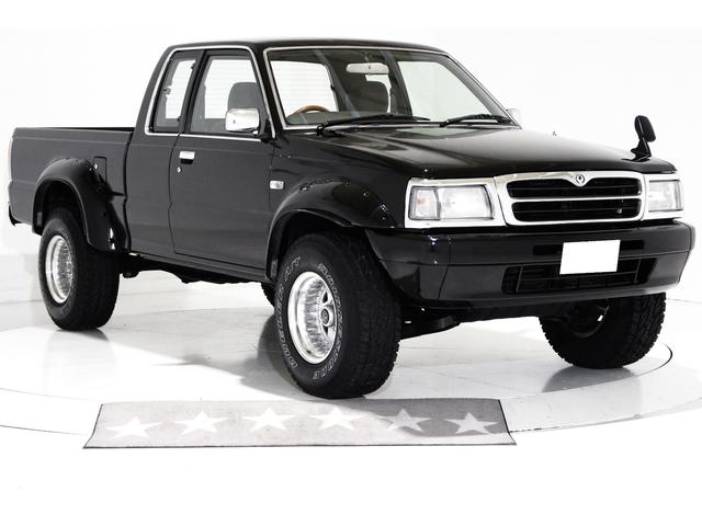 プロシード キャブプラス　４ＷＤ　リフトアップ　ワイドオーバーフェンダー　リアクロームメッキステップバンパー　ウッドステアリング　社外１５インチアルミホイール　荷台チッピングコート済　クリアサイドマーカー　ＣＤ　ＡＵＸ　ＥＴＣ（19枚目）