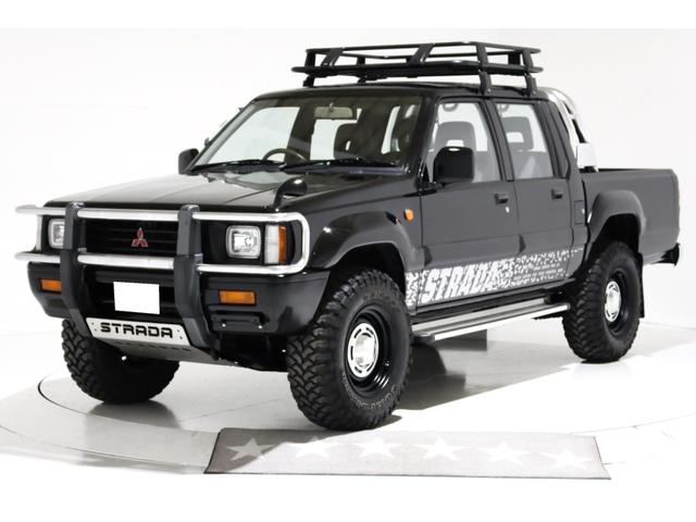 ストラーダ ブラックエディション　４ＷＤ　５ＭＴ　新品タイミングベルト交換　スキッドプレート　荷台チッピングコート済　クリスタルヘッドライト　イカリング　ＡＰＪ製ルーフラック　ＡＰＪ製ヴィンテージアルミ　フロントパワーウインドウ（2枚目）