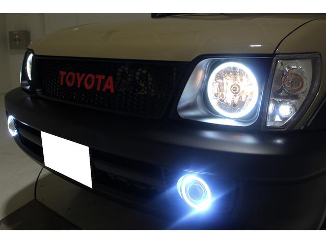 ランドクルーザープラド TX リミテッド 4WD 丸目仕様 APJ製ヴィンテージグリル APJ製レザー調シートカバー APJ製ヴィンテージ16インチアルミホイール LEDテールランプ LEDイカリングフォグランプ 8人乗3列シート(35枚目)