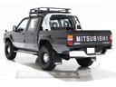 ブラックエディション　４ＷＤ　５ＭＴ　新品タイミングベルト交換　スキッドプレート　荷台チッピングコート済　クリスタルヘッドライト　イカリング　ＡＰＪ製ルーフラック　ＡＰＪ製ヴィンテージアルミ　フロントパワーウインドウ(11枚目)