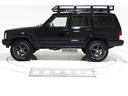 ジープ・チェロキー リミテッド　４ＷＤ　リフトアップ　ＡＰＪ製ビッグサイズルーフラック　クロームメッキグリル　コンビテールランプ　社外１６インチアルミホイール　電動本革シート　キーレス　天張り張替済み　盗難防止イモビライザー付（8枚目）