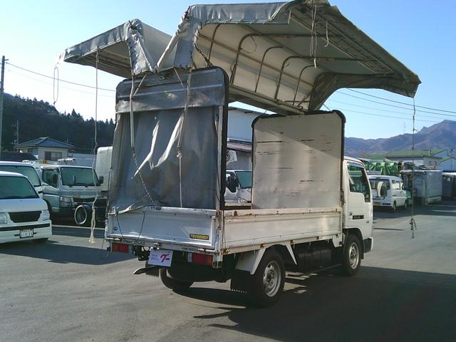 アトラストラック 　４ＷＤ　１．４５ｔ幌ウイング　ボディ内寸３０９０ｘ１５９０ｘ１８６０バックカメラ付き　エアコン・パワステ・パワーウインドウ　運転席側エアバッグ付き　５速マニュアル　切り替え４ＷＤＨ／Ｌ付（14枚目）