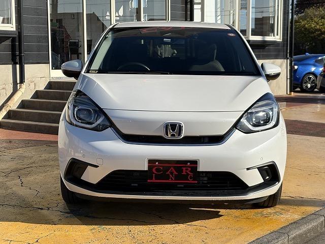 フィット ｅ：ＨＥＶホーム　衝突被害軽減ブレーキ　レーンキープアシスト　アダプティブクルーズコントロール　クリアランスソナー　オートハイビーム　ＬＥＤオートライト　ステアリングリモコン　純正ナビ　バックカメラ　Ｂｌｕｅｔｏｏｔｈ（14枚目）