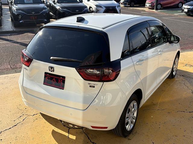 フィット ｅ：ＨＥＶホーム　衝突被害軽減ブレーキ　レーンキープアシスト　アダプティブクルーズコントロール　クリアランスソナー　オートハイビーム　ＬＥＤオートライト　ステアリングリモコン　純正ナビ　バックカメラ　Ｂｌｕｅｔｏｏｔｈ（23枚目）