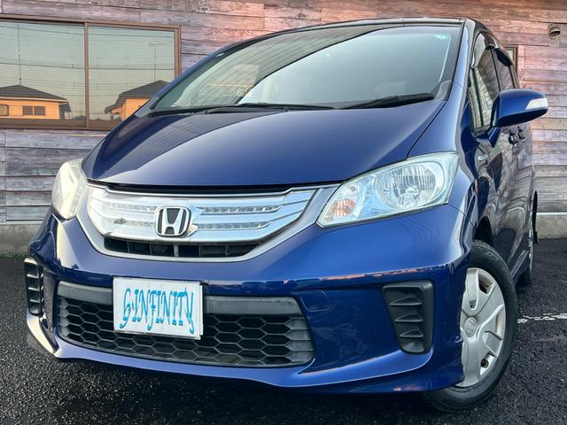 フリードハイブリッド ジャストセレクション　／検：２年付／走：４．３万ｋｍ／外ナビ／フリップダウン／Ｂカメラ／フルセグ／ＤＶＤ／Ｂｌｕｅｔｏｏｔｈ／左側電動スライド／ＨＩＤ／ＥＴＣ／スマキ－／クルコン／ＡＵＴＯエアコン／ドアバイザ－／Ｔチェ－ン（2枚目）