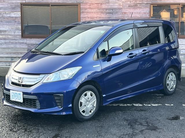 フリードハイブリッド ジャストセレクション　／検：２年付／走：４．３万ｋｍ／外ナビ／フリップダウン／Ｂカメラ／フルセグ／ＤＶＤ／Ｂｌｕｅｔｏｏｔｈ／左側電動スライド／ＨＩＤ／ＥＴＣ／スマキ－／クルコン／ＡＵＴＯエアコン／ドアバイザ－／Ｔチェ－ン（18枚目）