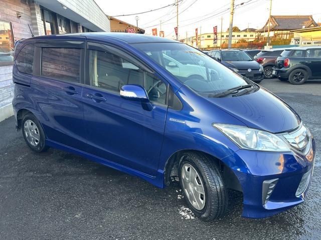 フリードハイブリッド ジャストセレクション　／検：２年付／走：４．３万ｋｍ／外ナビ／フリップダウン／Ｂカメラ／フルセグ／ＤＶＤ／Ｂｌｕｅｔｏｏｔｈ／左側電動スライド／ＨＩＤ／ＥＴＣ／スマキ－／クルコン／ＡＵＴＯエアコン／ドアバイザ－／Ｔチェ－ン（36枚目）