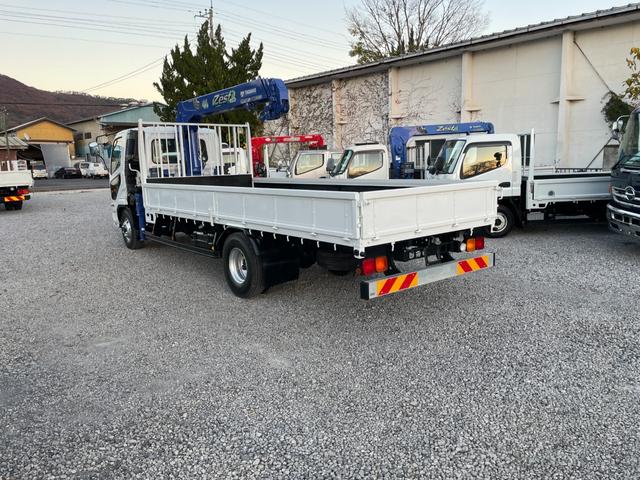 ファイター 　２．７ｔ　４段クレーン付き　　平ボディロング　　ラジコン付き　左電動格ミラー　　架装メーカータダノ　フックインあり　６速マニュアル　　クレーンの型式ＺＥ３０４ＨＲＮ　全塗装済みトラック（64枚目）