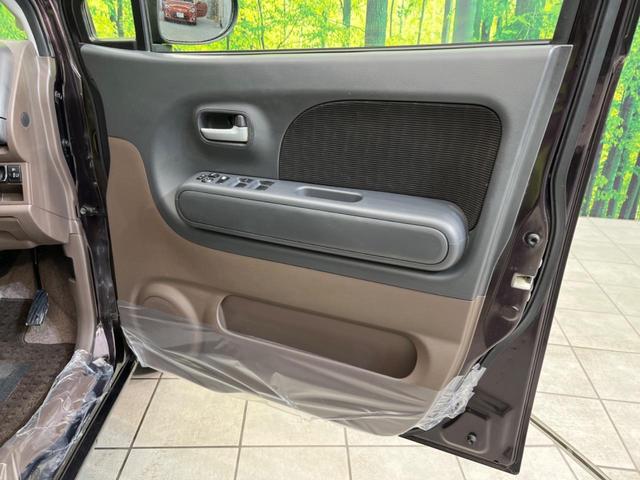 E ショコラティエ 純正ナビ 禁煙車 Bluetooth再生 スマートキー オートライト オートエアコン DVD再生 CD再生 地デジ 盗難防止装置 プライバシーガラス シートリフター トラクションコントロール(28枚目)
