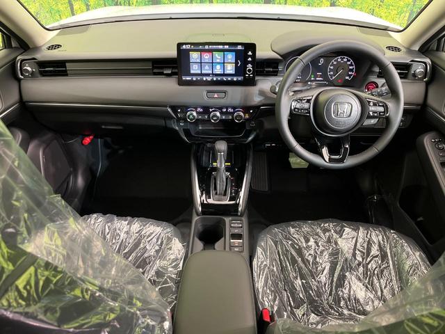 ヴェゼル ｅ：ＨＥＶ　Ｚ　登録済未使用車　純正９型ナビ　バックカメラ　ホンダセンシング　禁煙車　ＥＴＣ　Ｂｌｕｅｔｏｏｔｈ接続　シートヒーター　パワーバックドア　ハーフレザーシート　ＬＥＤヘッドライト　置くだけ充電（2枚目）