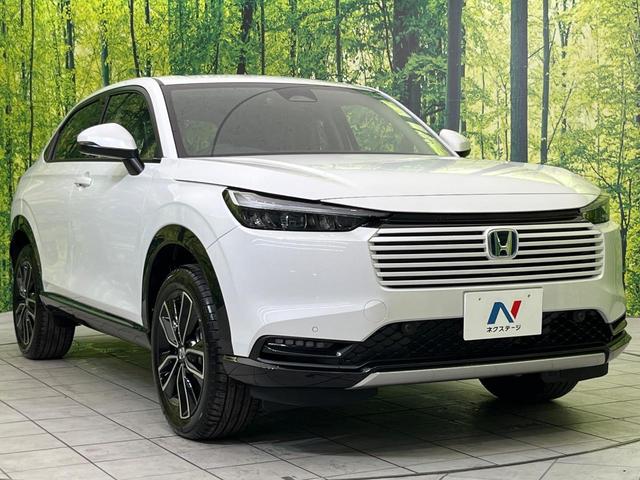 ヴェゼル ｅ：ＨＥＶ　Ｚ　登録済未使用車　純正９型ナビ　バックカメラ　ホンダセンシング　禁煙車　ＥＴＣ　Ｂｌｕｅｔｏｏｔｈ接続　シートヒーター　パワーバックドア　ハーフレザーシート　ＬＥＤヘッドライト　置くだけ充電（16枚目）