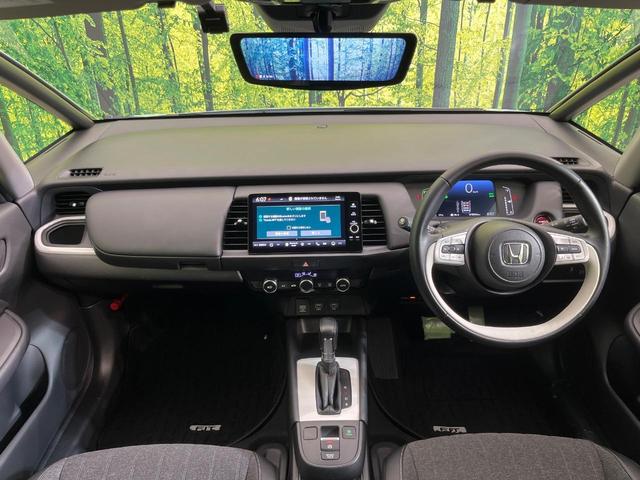 フィット e:HEVホーム 純正9型ナビ バックカメラ ホンダセンシング 禁煙車 ハーフレザーシート コーナーセンサー スマートキー LEDヘッド ETC2.0 車線逸脱警報 オートライト オートエアコン 電動格納ミラー(2枚目)