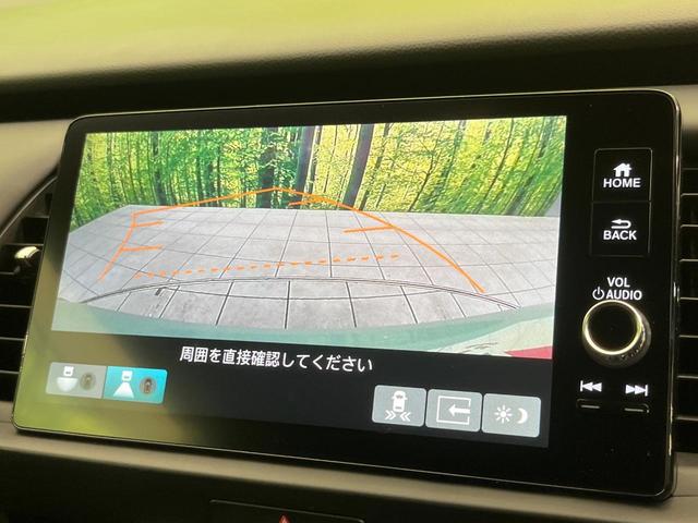 フィット e:HEVホーム 純正9型ナビ バックカメラ ホンダセンシング 禁煙車 ハーフレザーシート コーナーセンサー スマートキー LEDヘッド ETC2.0 車線逸脱警報 オートライト オートエアコン 電動格納ミラー(4枚目)
