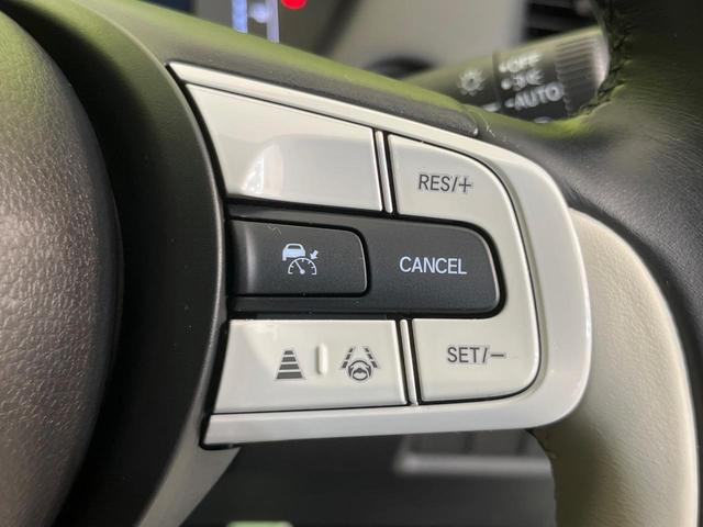 フィット e:HEVホーム 純正9型ナビ バックカメラ ホンダセンシング 禁煙車 ハーフレザーシート コーナーセンサー スマートキー LEDヘッド ETC2.0 車線逸脱警報 オートライト オートエアコン 電動格納ミラー(5枚目)