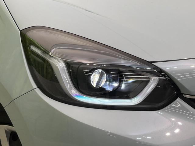 フィット e:HEVホーム 純正9型ナビ バックカメラ ホンダセンシング 禁煙車 ハーフレザーシート コーナーセンサー スマートキー LEDヘッド ETC2.0 車線逸脱警報 オートライト オートエアコン 電動格納ミラー(12枚目)