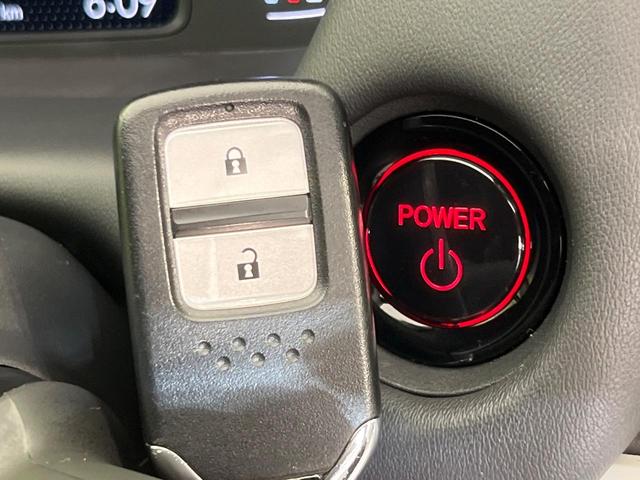 フィット e:HEVホーム 純正9型ナビ バックカメラ ホンダセンシング 禁煙車 ハーフレザーシート コーナーセンサー スマートキー LEDヘッド ETC2.0 車線逸脱警報 オートライト オートエアコン 電動格納ミラー(25枚目)