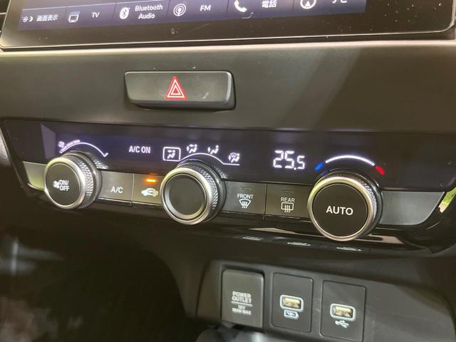 フィット e:HEVホーム 純正9型ナビ バックカメラ ホンダセンシング 禁煙車 ハーフレザーシート コーナーセンサー スマートキー LEDヘッド ETC2.0 車線逸脱警報 オートライト オートエアコン 電動格納ミラー(26枚目)