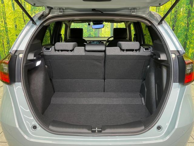 フィット e:HEVホーム 純正9型ナビ バックカメラ ホンダセンシング 禁煙車 ハーフレザーシート コーナーセンサー スマートキー LEDヘッド ETC2.0 車線逸脱警報 オートライト オートエアコン 電動格納ミラー(33枚目)