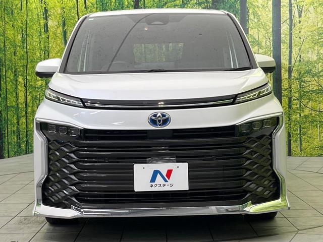 ヴォクシー ハイブリッドＳ－Ｚ　快適利便ＰＫＧ　純正１０．５型ナビ　三眼ＬＥＤヘッドライト　全周囲カメラ　トヨタチームメイト　ＢＳＭ　禁煙車　両側電動ドア　電動リアゲート　前中席シートヒーター　ハンドルヒーター　ＥＴＣ　ＨＤＭＩ（15枚目）