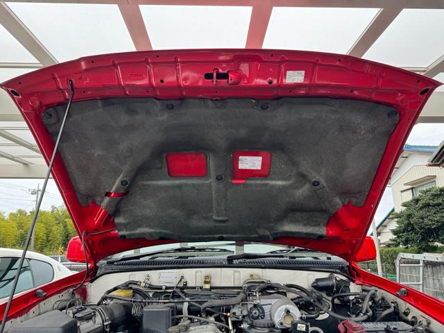 ハイラックスサーフ ＳＳＲ－Ｘ　ホワイトプレミアム　平成１４年車　全塗装済みレッド　リフトアップ　買取車　ナルディウッドハンドル　シートカバー　キーレス　フルセグ　ナビ　ＥＴＣ　記録簿（10枚目）