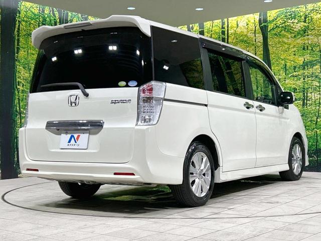 ステップワゴンスパーダ Ｚ　ＨＤＤナビエディション　禁煙車　両側電動スライドドア　後席モニター　純正ＨＤＤナビ　ＣＤ／ＤＶＤ再生　バックカメラ　ビルトインＥＴＣ　キーフリー　ＨＩＤヘッドライト　オートライト　電動格納ミラー　オートエアコン　ドアバイザー（18枚目）