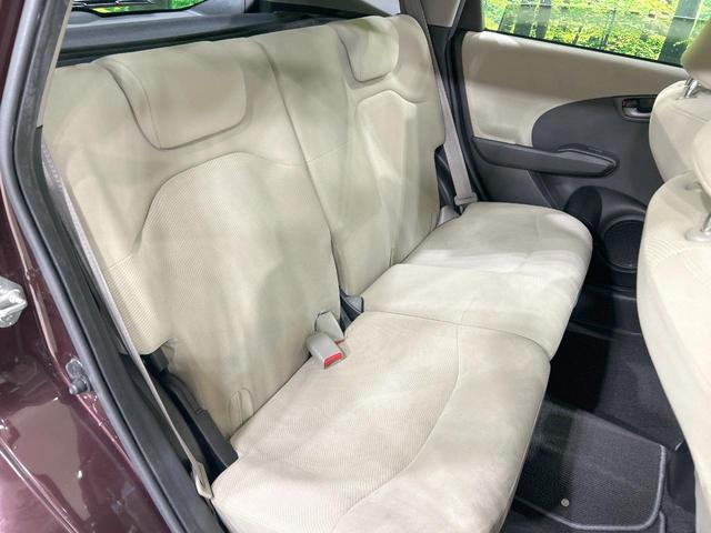 フィット X 純正ナビ バックカメラ クルーズコントロール 禁煙車 HIDヘッド ETC オートライト オートエアコン 純正15インチAW CD/DVD再生 地デジ ドアバイザー 電動格納ミラー 革巻きステアリング(9枚目)
