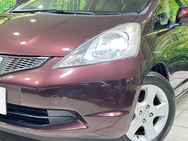 フィット X 純正ナビ バックカメラ クルーズコントロール 禁煙車 HIDヘッド ETC オートライト オートエアコン 純正15インチAW CD/DVD再生 地デジ ドアバイザー 電動格納ミラー 革巻きステアリング(12枚目)