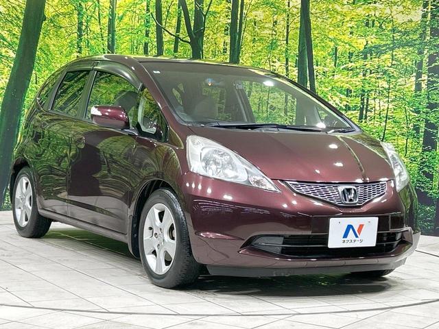 フィット X 純正ナビ バックカメラ クルーズコントロール 禁煙車 HIDヘッド ETC オートライト オートエアコン 純正15インチAW CD/DVD再生 地デジ ドアバイザー 電動格納ミラー 革巻きステアリング(16枚目)