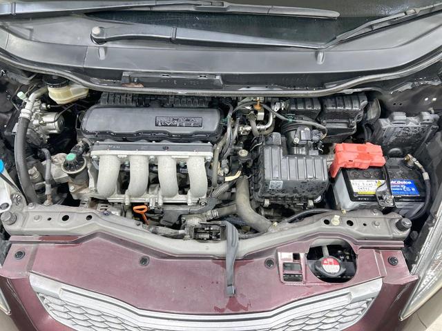フィット X 純正ナビ バックカメラ クルーズコントロール 禁煙車 HIDヘッド ETC オートライト オートエアコン 純正15インチAW CD/DVD再生 地デジ ドアバイザー 電動格納ミラー 革巻きステアリング(18枚目)
