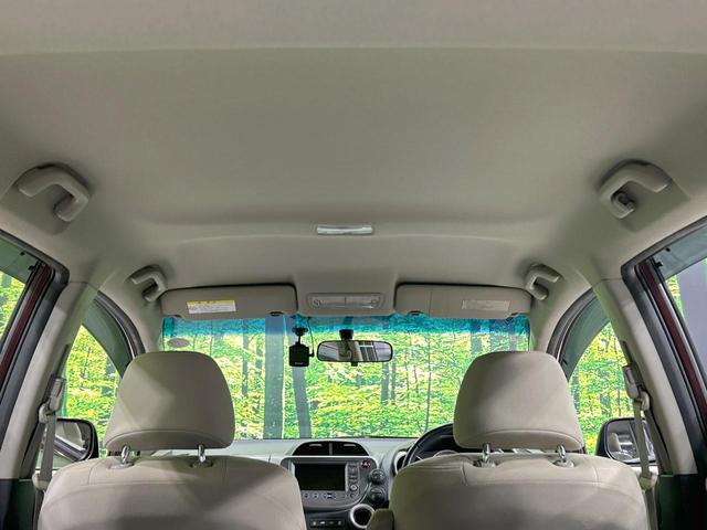 フィット X 純正ナビ バックカメラ クルーズコントロール 禁煙車 HIDヘッド ETC オートライト オートエアコン 純正15インチAW CD/DVD再生 地デジ ドアバイザー 電動格納ミラー 革巻きステアリング(36枚目)