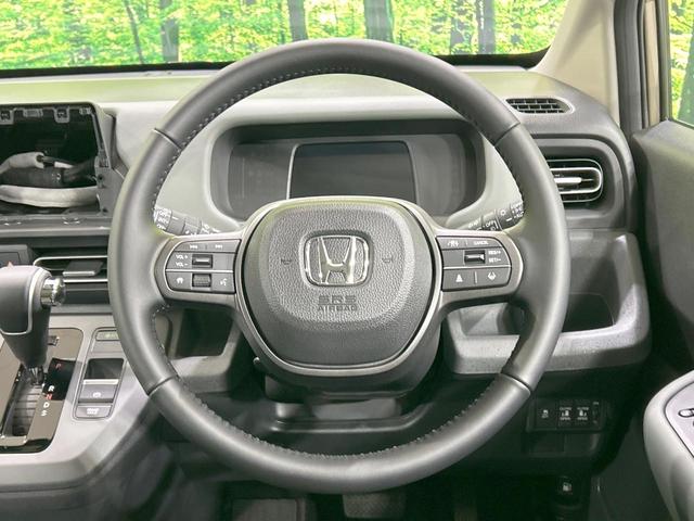 フリード クロスター 登録済未使用車 両側電動スライドドア ホンダセンシング ハーフレザーシート ブラインドスポットモニター レーンキープ スマートキー LEDヘッド ルーフレール 純正15インチAW オートハイビーム(11枚目)