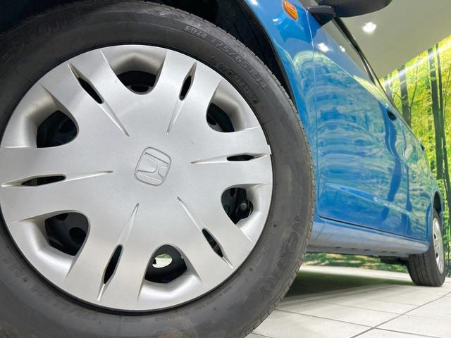 フィット Ｇ　禁煙車　ＣＤオーディオ　キーレスエントリー　エアコン　電動ドアミラー　バニティミラー　ＡＵＸ接続　パワーウィンドウ　衝突安全ボディ　ドアバイザー　盗難防止システム　パワーステアリング（12枚目）