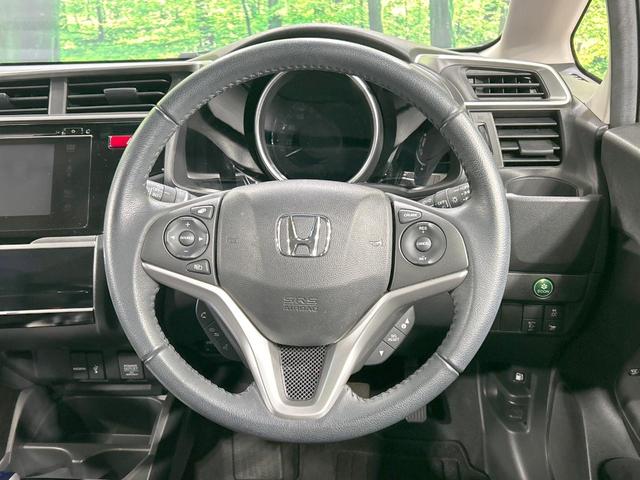 フィットハイブリッド Lパッケージ 純正ナビ バックカメラ シティブレーキ クルーズコントロール 禁煙車 ETC Bluetooth再生 ハーフレザーシート LEDヘッド オートライト オートエアコン スマートキー 革巻きステアリング(11枚目)