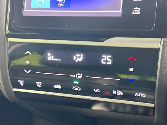 フィットハイブリッド Lパッケージ 純正ナビ バックカメラ シティブレーキ クルーズコントロール 禁煙車 ETC Bluetooth再生 ハーフレザーシート LEDヘッド オートライト オートエアコン スマートキー 革巻きステアリング(32枚目)