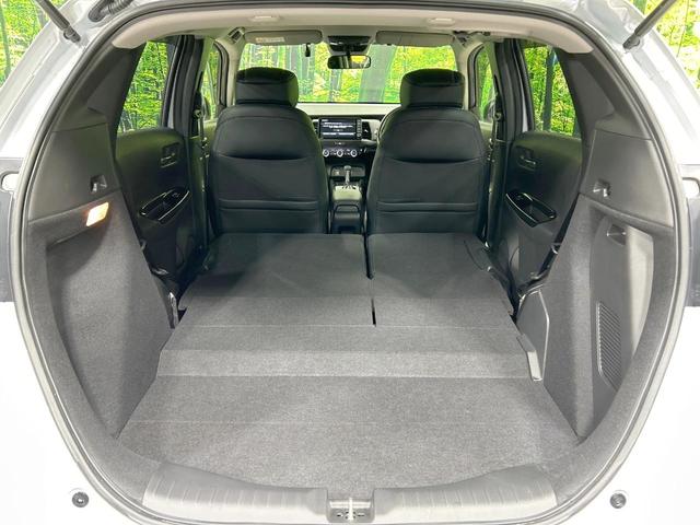 フィット e:HEVリュクス 純正9型ナビ バックカメラ ホンダセンシング 禁煙車 ハーフレザーシート 前席シートヒーター LEDヘッド&フォグ 純正16インチAW ステアリングヒーター コーナーセンサー ETC 置くだけ充電(10枚目)
